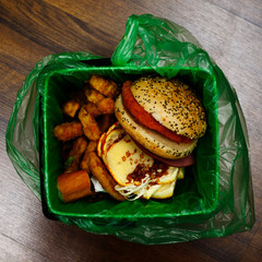 fast food waste in a degradable garbage bag