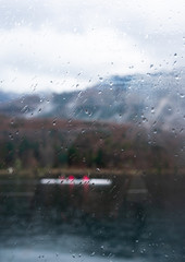 Rain droplets hitting the window of a boat