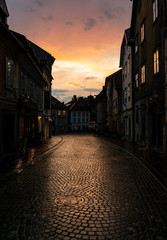Beautiful sunset colours reflecting in a narrow street in Slovenia