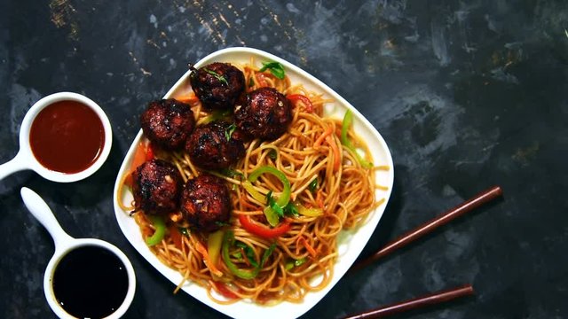 Manchurian Hakka / Schezwan noodles footage or clip, popular indochinese food served in a bowl. selective focus