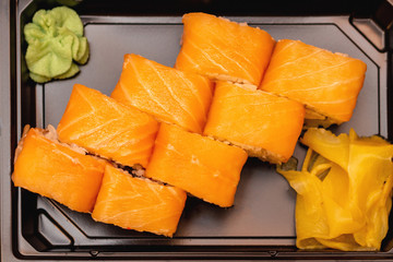 Fresh sushi and rolls fast food in a box close up