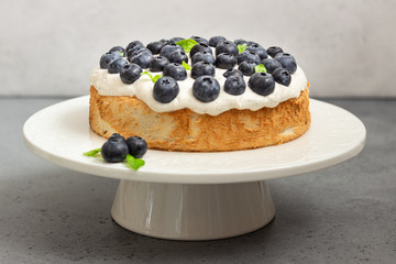 Angel food cake with whipped cream, fresh blueberries and basil. 