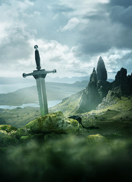 An aged knights sword stuck in the ground with the rolling mountains from the Isle of Skye in the background. Fantasy 3D mixed media illustration.