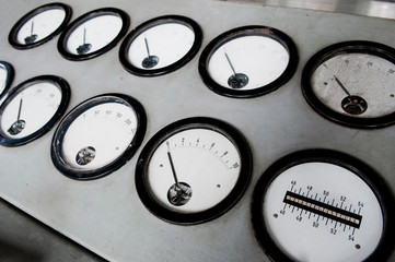 Details of an old black analog ampere meter.