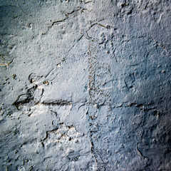 Dark uneven rough concrete wall