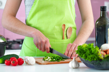Chopped vegetables for fresh salad on chopping board for dinner close up. Clean healthy food and proper nutrition. Diet