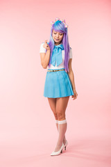 Full length view of anime girl in blue skirt showing heart sign on pink