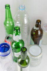 Sets of empty pot, bowl, glass bottles and plastic bottles with no label on a white background. Reuse, Eco-Friendly, Environment, Conservation, Sustainable and Resources concept.