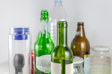 Sets of empty pot, bowl, glass bottles and plastic bottles with no label on a white background. Reuse, Eco-Friendly, Environment, Conservation, Sustainable and Resources concept.