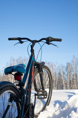 Fototapeta na wymiar Bike on snow after high snowfall