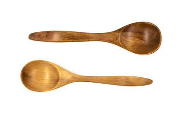 Empty wooden spoons isolated on white background, close up