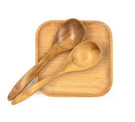 Empty wooden cups (plates) with spoons on white background