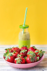 kiwi and apple smoothies on a yellow background