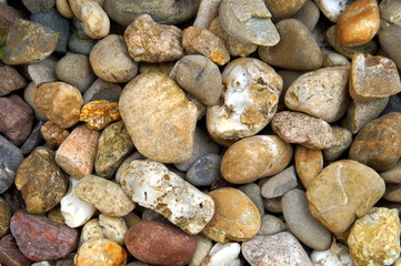 Sea pebbles background. Stones seamless pattern. seamless background with smooth pebble. Natural colors seaside pebble.  Spa stones flat design. colorful beautiful stones background texture 