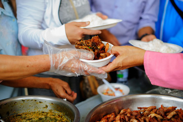 Poverty in society Poor people have been donating food from the philanthropist : Concept poverty and donation : Volunteers Share Food to the Poor to Relieve Hunger