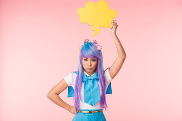Dissatisfied asian anime girl holding thought bubble on pink