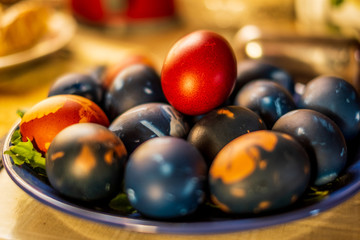 Traditional easter eggs on a plate isolated with a blurred background