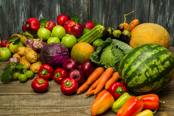 various vegetables from the vegetable garden on the table, agricultural products, potatoes, cabbage, apple, watermelon, garlic, melon, zucchini, zucchini, eggplant, nuts, carrots, red cabbage,