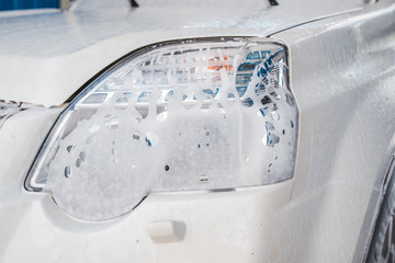 car wash concept. vehicle in soap