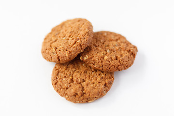 three oat cookies  on white background photo with nuts healthy food, for the diet