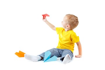 Happy boy with paper plane isolated on white,  fly.Happy boy with paper plane isolated on white,  fly.
