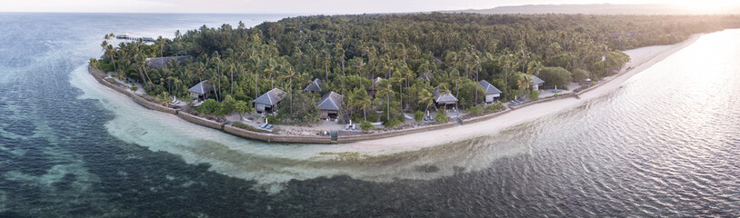 Fototapeta na wymiar An idyllic tropical resort is found on a remote island in the Wakatobi National Park, Indonesia. This region is known for its incredible coral reefs and high marine biodiversity.