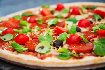 Sausage Pizza with Ham and tomatoes