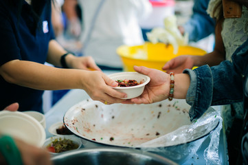 concept of begging food : Beggar begs food from donors: concept of poverty in Asian society