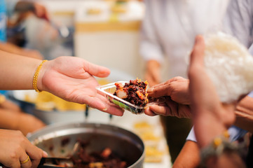 concept of begging food : Beggar begs food from donors: concept of poverty in Asian society