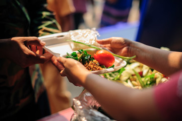 Beggar begs food from donors: Caring for fellow human beings in society by giving food, Giving Without Hope : The Concept of Poor Care