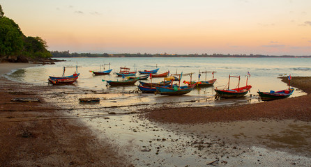 Fototapeta na wymiar Thai village fishing boats park on the beach