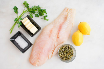 Grouper with Lemon-Caper Butter Ingredients: Large boneless whitefish fillet with capers, lemons,...