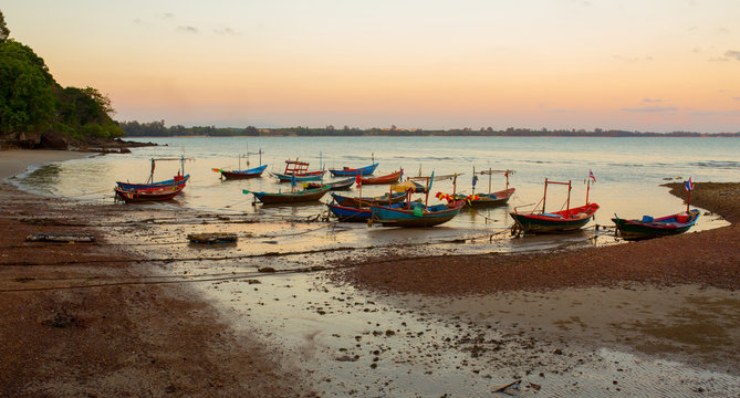 Thai village fishing boats park on the beach