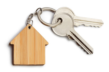 House keys with house shaped keychain, isolated on white background