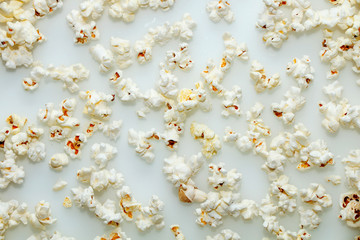 Fresh hot popcorn scattered on the table