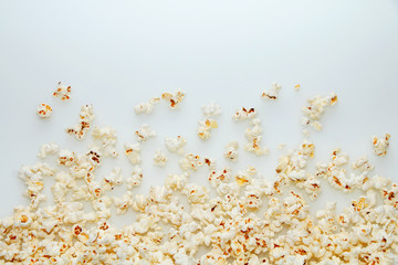Fresh hot popcorn scattered on the table
