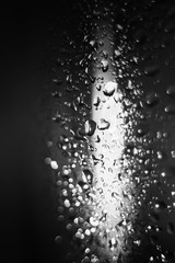 black and white drops on the glass surface, macro, abstraction