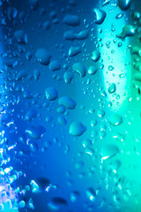 blue with a turquoise drop on a glass surface, macro, abstraction