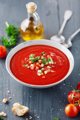 Tasty summer tomato soup served in bowl