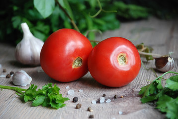 tomatoes, garlic, spices and herbs on the table