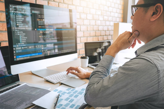Professional Developer programmer working a software website design and coding technology, writing codes and database in company office, Global cyber connection technology