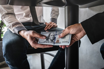 Dishonest cheating in business illegal money, Businessman receive bribe money under table to...