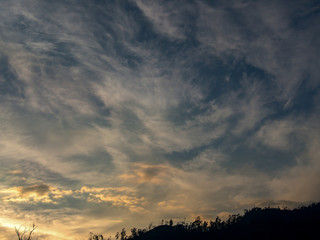 Astonishing cirrus clouds formation at sunset over the Andean mountains of central Colombia.