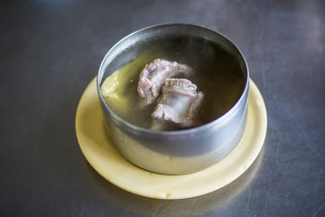 Bitter gourd soup pork ribs in metal bow soup delicious meal
