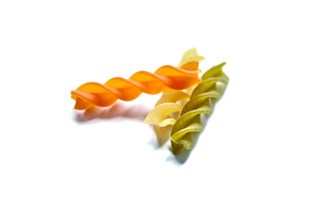 Italian pasta Fusilli tricolore isolated on a white background