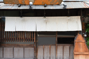 The curtain-like fabric that hangs in front of traditional Japanese restaurants and shops not only serves as a signboard, but holds a larger meaning,