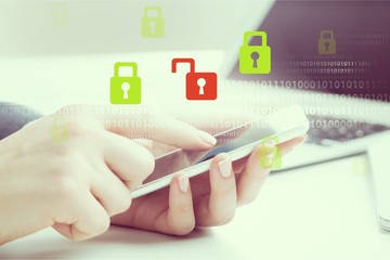 Hands holding smartphone  on background