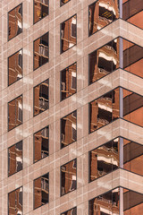 Copper geometric windows in a building