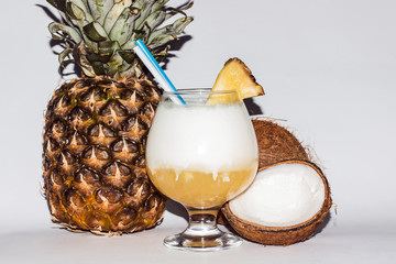 Pina сolada, a tropical cocktail in a beautiful glass with a slice of pineapple.