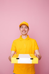 Photo of courier man with pizza box in hands .